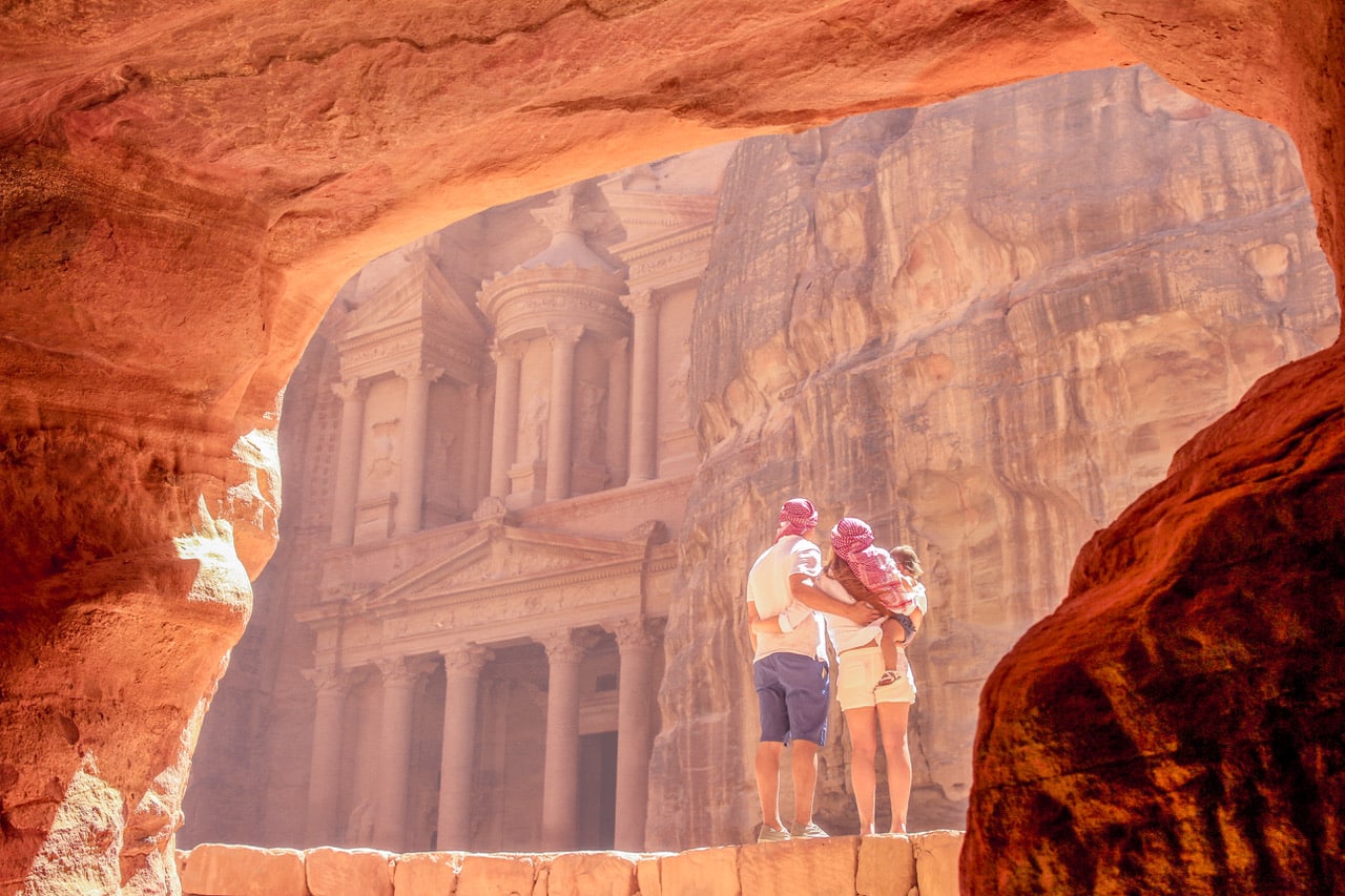 The Traveling Red and her family looking out at Petra